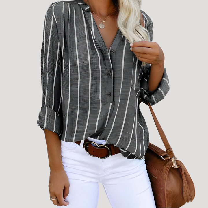 Élégante chemise femme rayée manches longues, idéale pour mode printemps/automne. Blouse chic et décontractée.