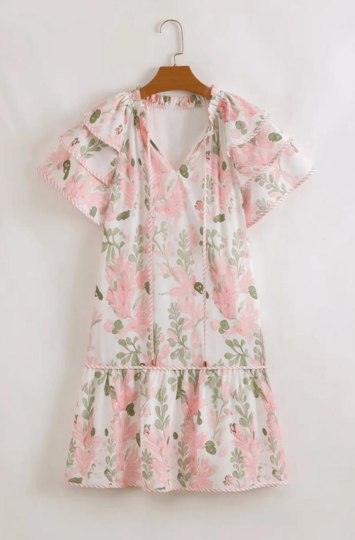 Mini robe fleurie Aura pour femme, chic et légère. Parfaite pour les journées d'été ou les sorties décontractées.