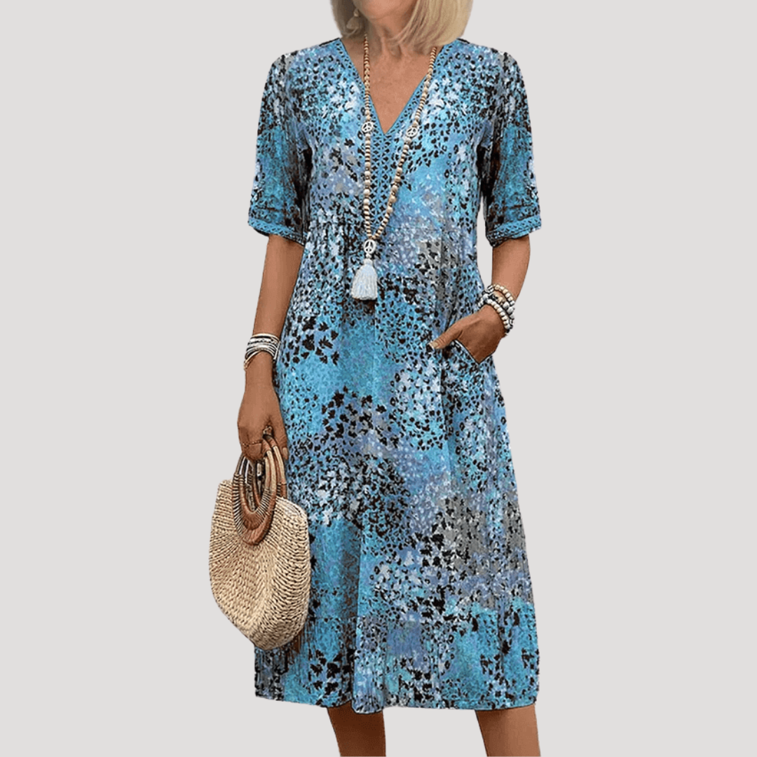 Robe midi imprimée fleurie pour femme. Style bohème chic, parfait pour l'été. Élégante et confortable pour toute occasion.
