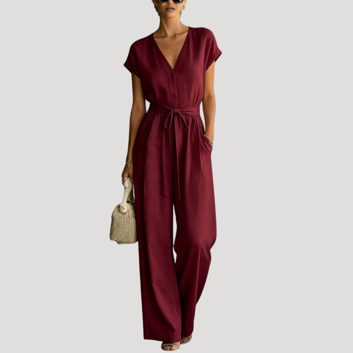 Élégante combinaison femme col V ceinturée, fluide, parfaite pour une tenue chic et polyvalente.