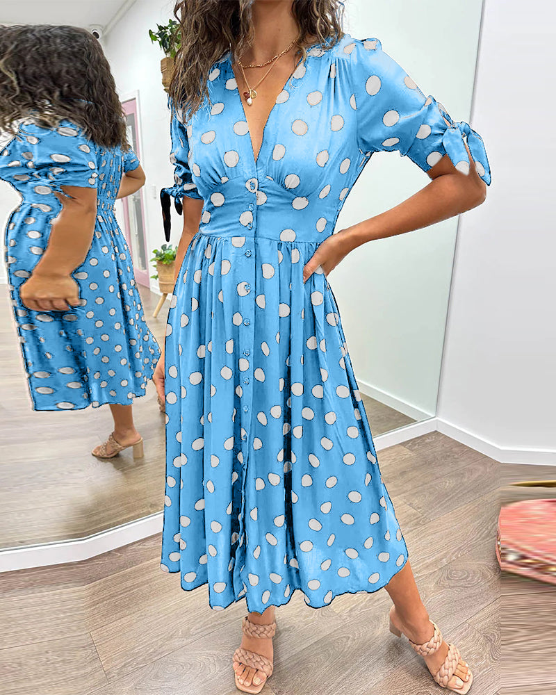 Robe midi femme, fluide et légère, motif pois, mode chic et confortable pour l'été.