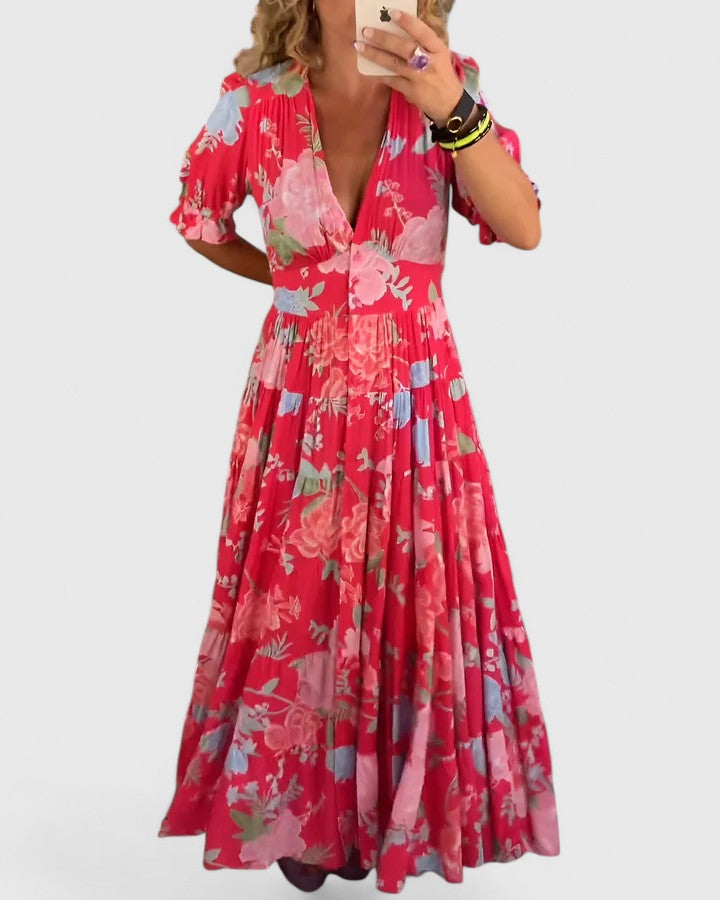 Robe fleurie élégante femme, col V, coupe longue et fluide. Idéale pour un look estival et chic.