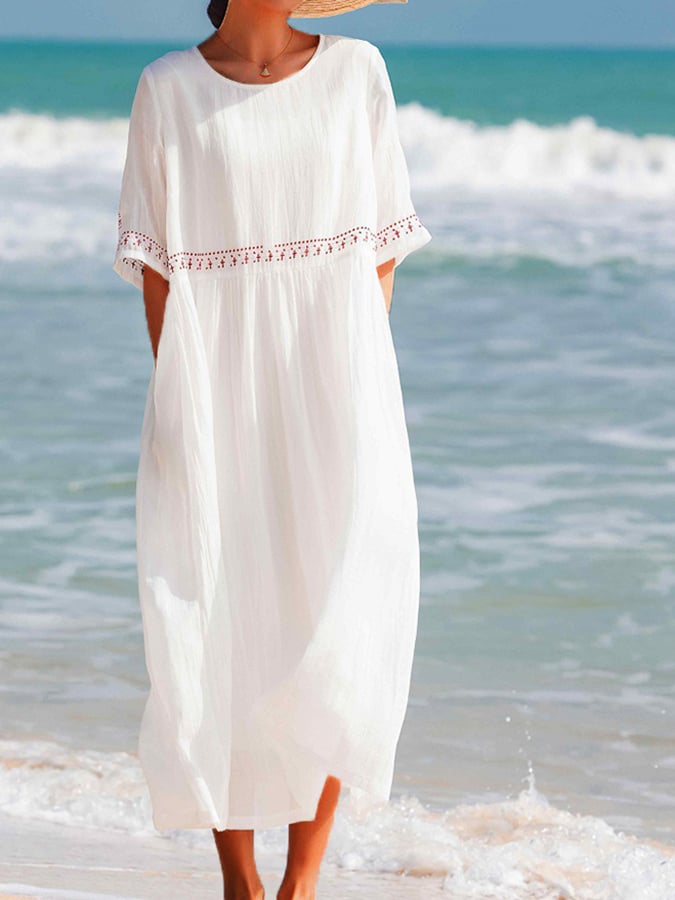 Robe maxi estivale brodée, style bohème chic, offrant élégance et confort pour les journées ensoleillées.