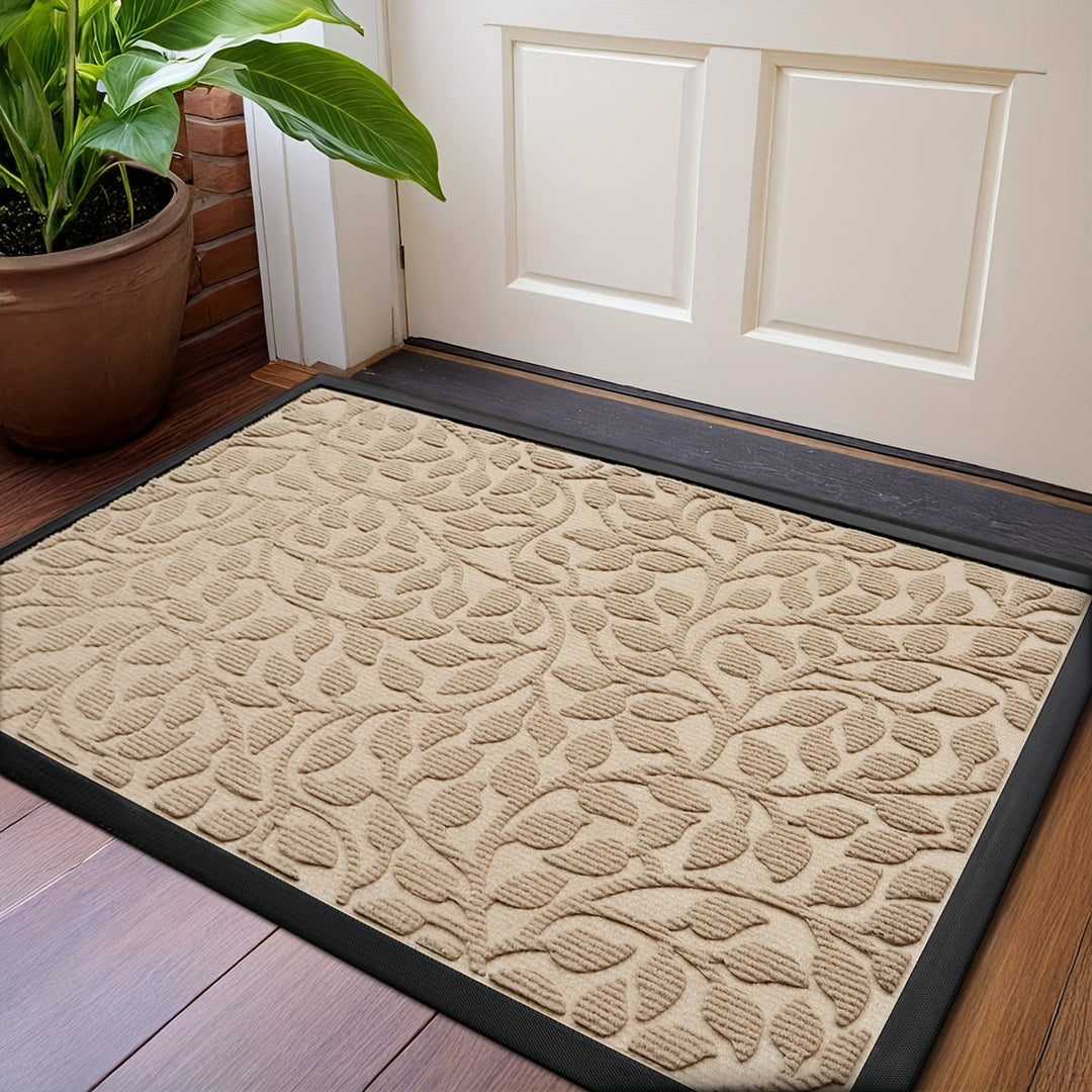 Tapis d'entrée design moderne en fibres synthétiques, résistant et protecteur pour le sol.