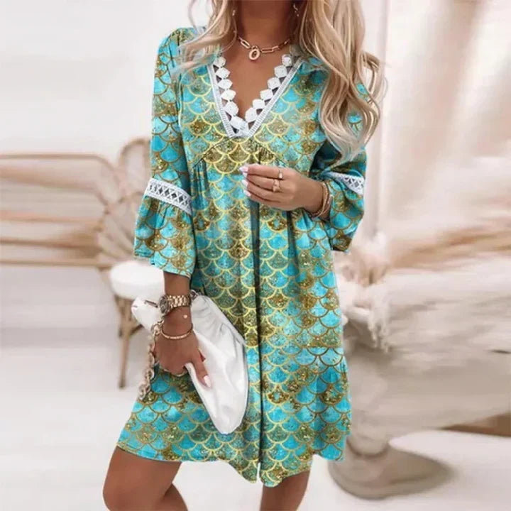 Robe d'été femme avec imprimé floral coloré, style décontracté et léger.