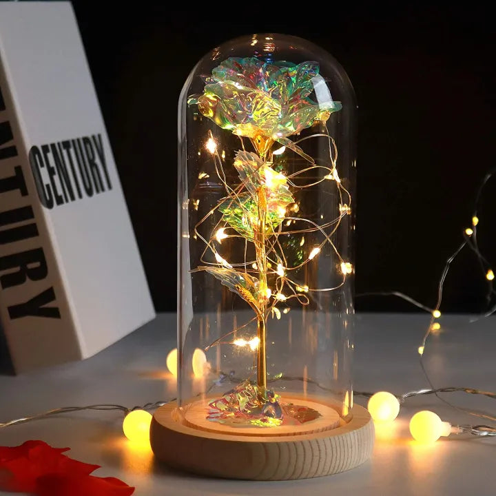 Fleur éternelle sous verre, lampe de table LED rose pour une touche de nature et de lumière intérieure.