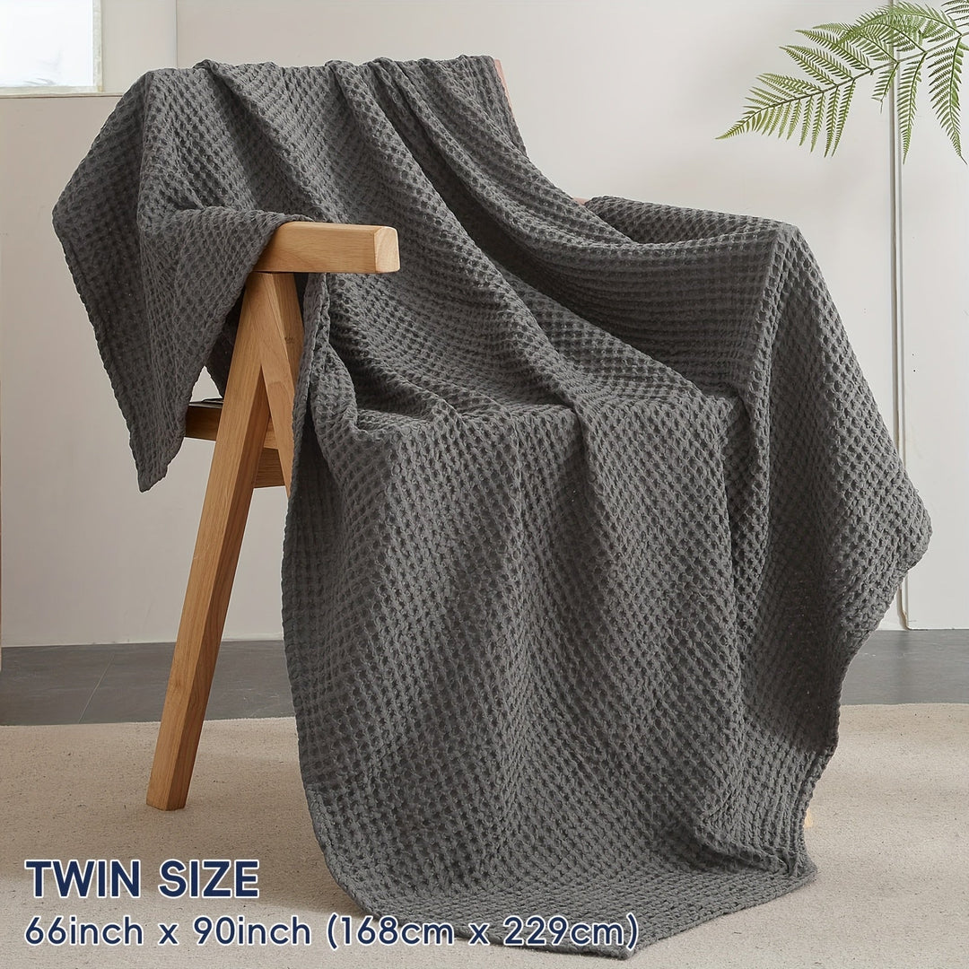 Couverture gaufrée Cloudweave, un must-have pour une chambre confortable et une décoration élégante.