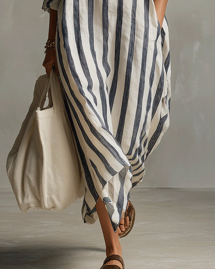 Tenue décontractée chic : robe maxi fluide rayée, manches longues et col revers. Mode femme printemps automne.