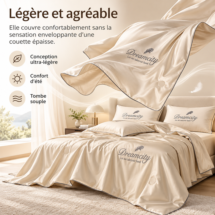 Literie d'été rafraîchissante en polyester et soie glacée, assure confort et fraîcheur nocturne.