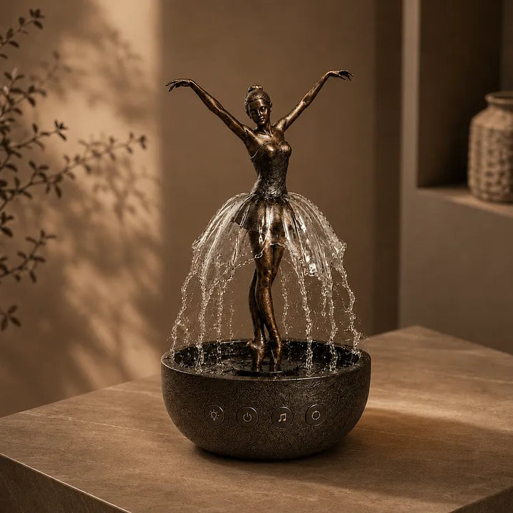 Fontaine de table décorative en résine avec ballerine rotative et LED intégrées. Crée une atmosphère zen et relaxante.