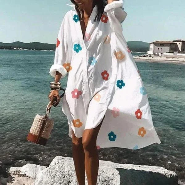 Mode féminine: Robe chemise blanche, midi et fluide. Confortable et chic, elle est parfaite pour vos journées d'été.