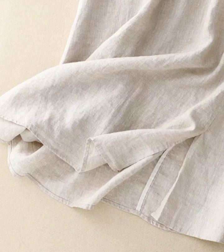 Jupe d'été femme mi-longue A-line, taille haute, tissu fluide, style casual chic.