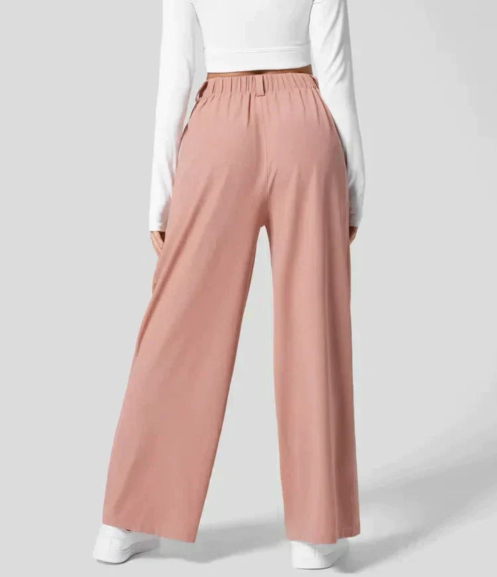 Pantalon large femme bleu, coupe fluide taille haute, chic et confortable pour une mode décontractée élégante.