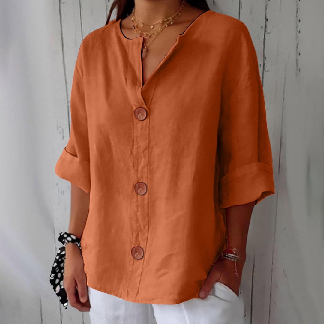 Blouse femme élégante, col tunisien, coupe ample, pour un style chic et confortable.