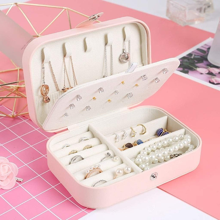 Boîte à bijoux de voyage en cuir bleu, organisateur compact pour tous vos accessoires précieux de voyage.