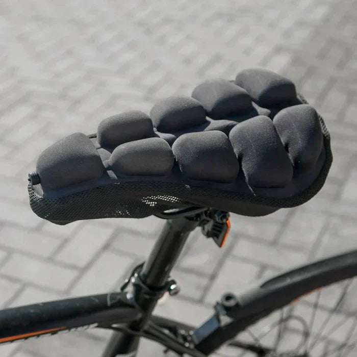 Coussin de selle vélo gonflable LuxRide bleu. Confort cyclisme longue distance, anti-choc, respirant.
