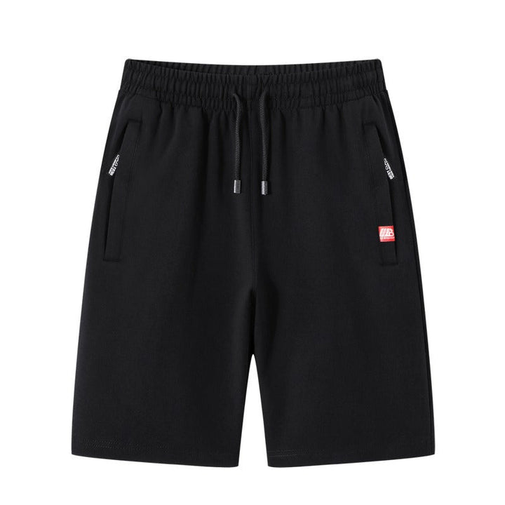 Short décontracté homme bleu marine, tissu léger et confortable. Basique essentiel avec poches zippées pour l'été.