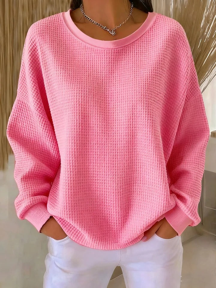Sweat-shirt femme texturé au toucher agréable, idéal pour une élégance décontractée et moderne.