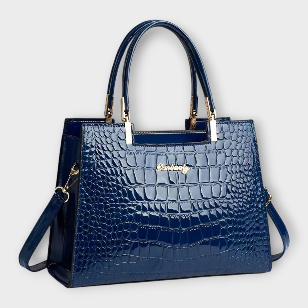 Sac à main femme moderne, motif crocodile brillant. L'accessoire chic et pratique pour vos sorties élégantes.