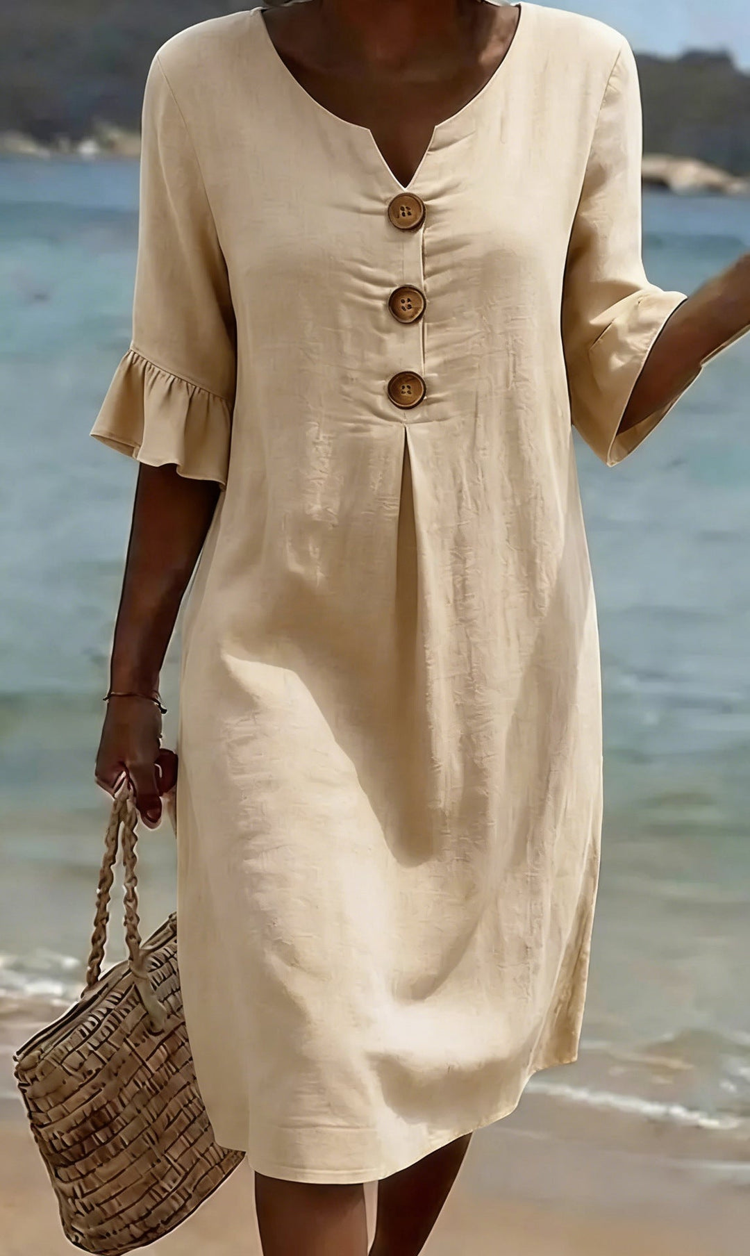 Robe femme estivale fluide en coton lin, boutonnée. Manches volantées. Confortable et légère pour les vacances.