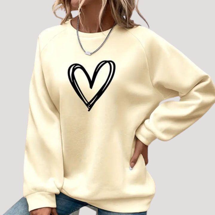 Pull femme mode avec motif cœur fantaisie, col rond, chandail confortable et élégant pour le quotidien.
