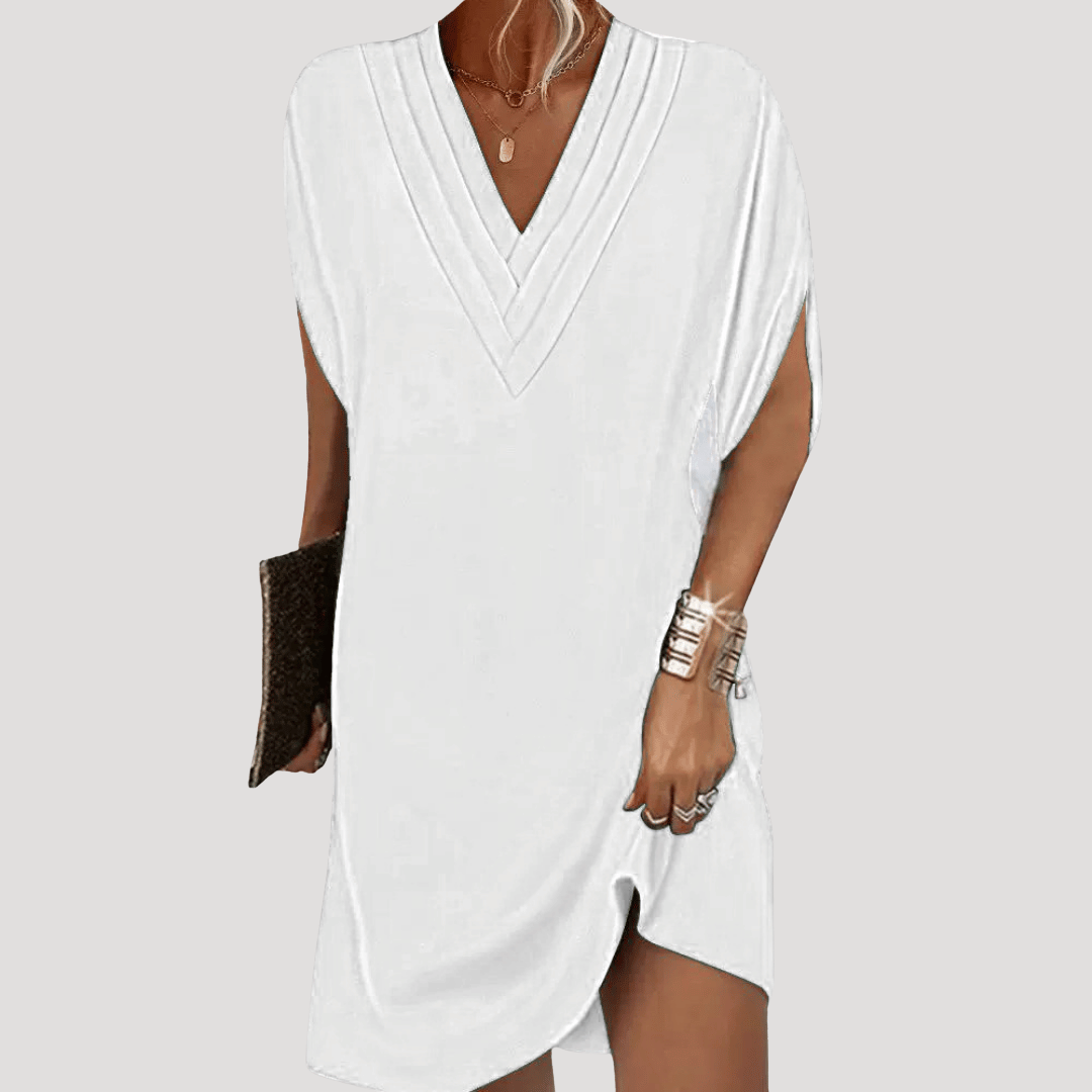Robe polyvalente femme, courte et fluide avec col V, pour un look confortable et élégant en toute occasion.