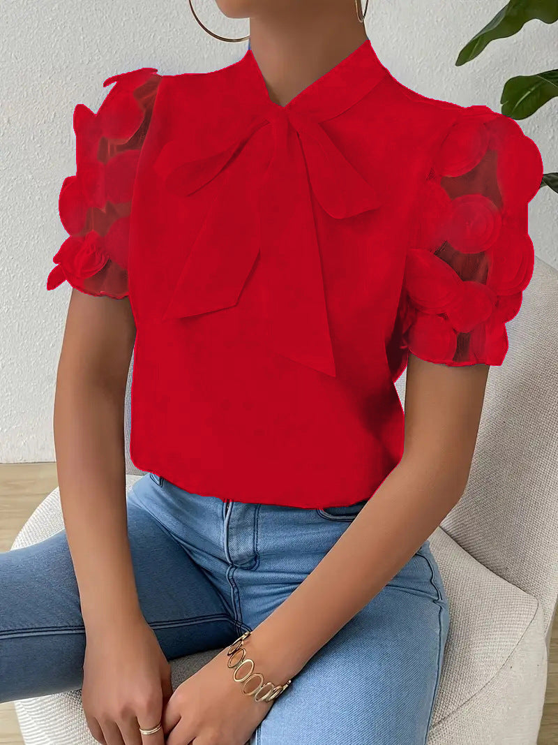 Haut femme chic et polyvalent, idéal pour le printemps/été, avec nœud frontal et manches transparentes.