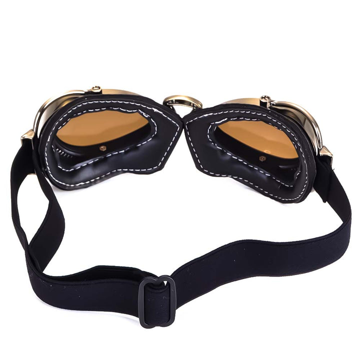 Paire de lunettes moto classiques, monture chromée et verres protecteurs, accessoire pliable.
