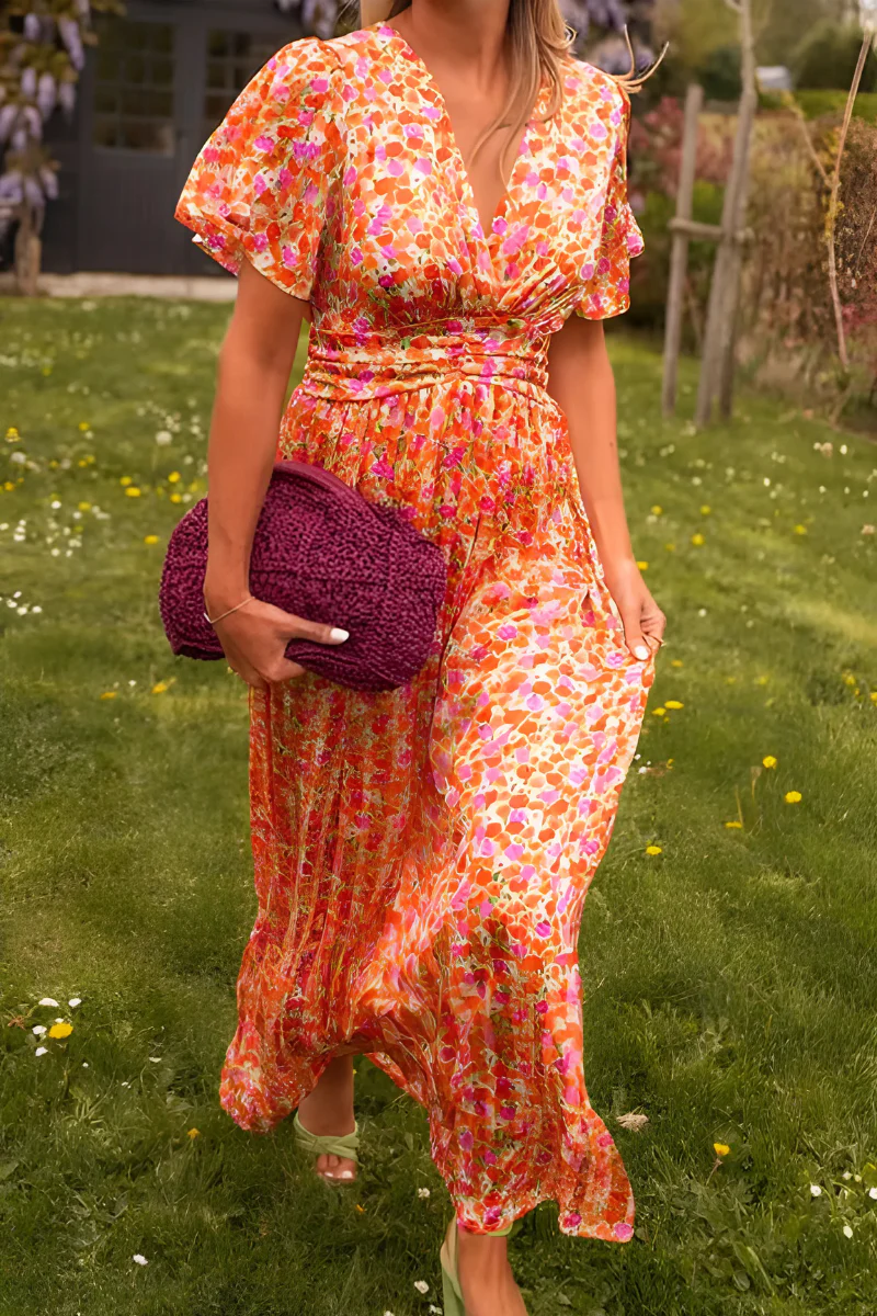 Robe fluide fleurie Elisa pour femme, élégante et sans manches, parfaite pour printemps, été, vacances et journée.