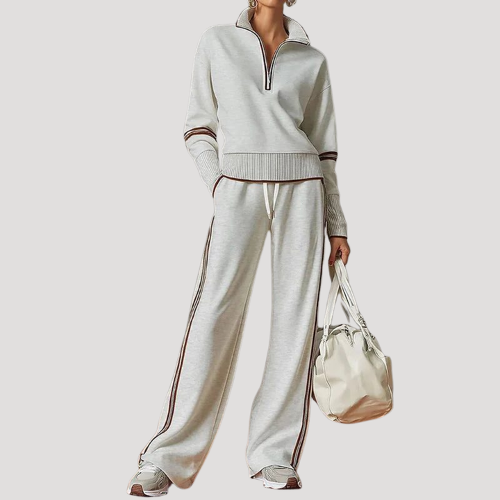 Vêtements coordonnés femme en maille douce, haut col zippé et pantalon large. Style décontracté chic.