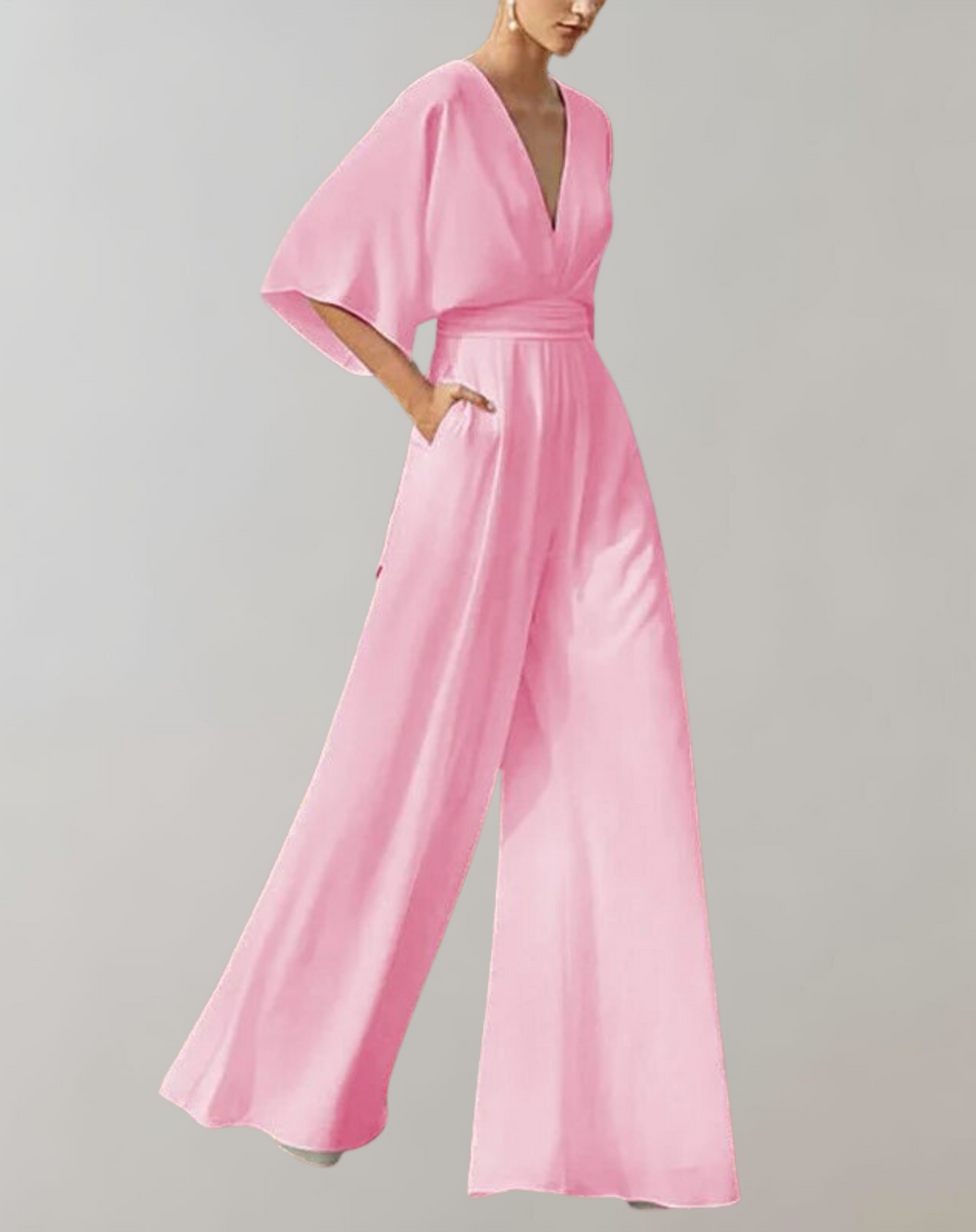 Jumpsuit de soirée femme chic avec décolleté plongeant et pantalon large. Tenue habillée élégante et moderne.