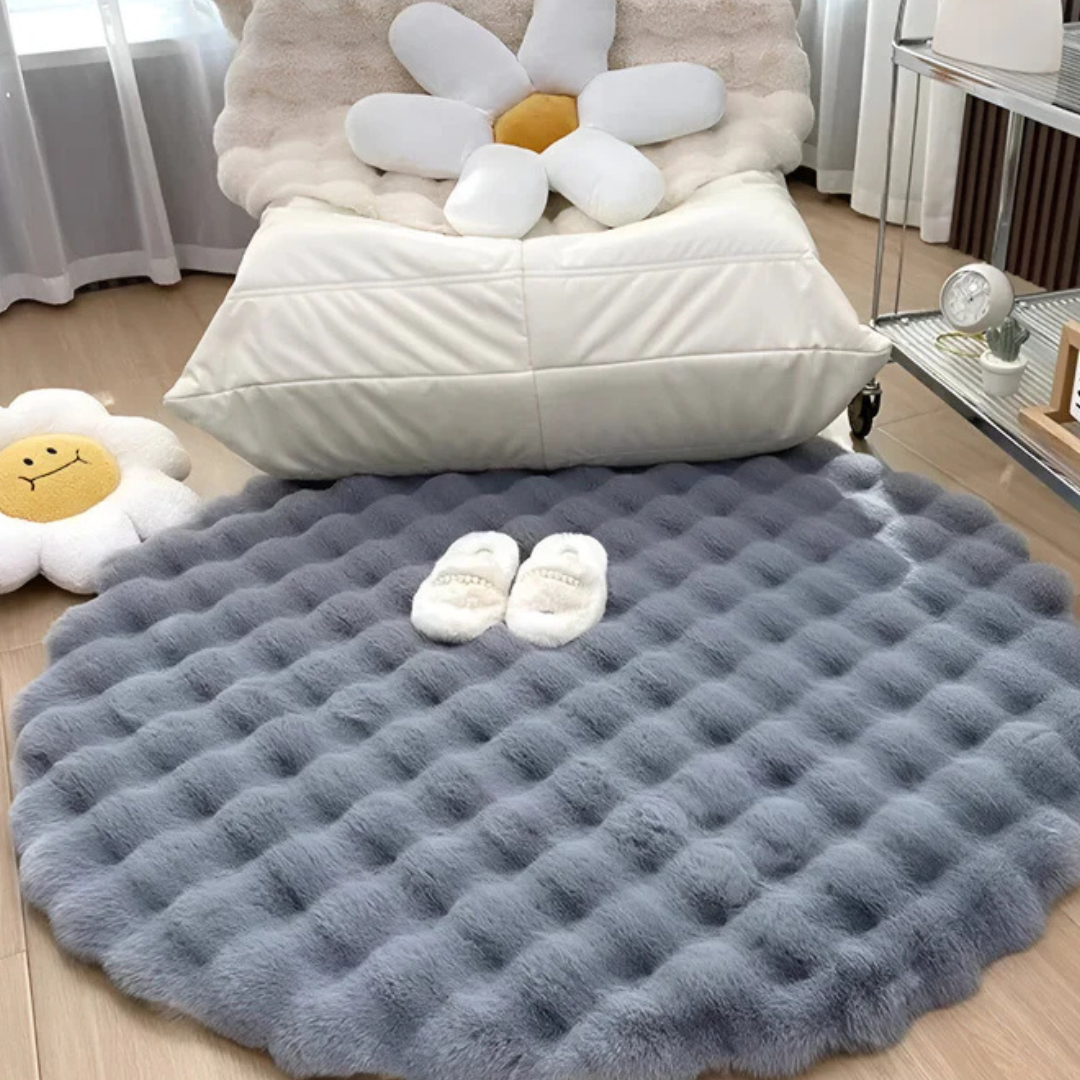 Tapis rond 80cm pour chambre, en polaire moelleuse, apporte une touche de confort moderne.