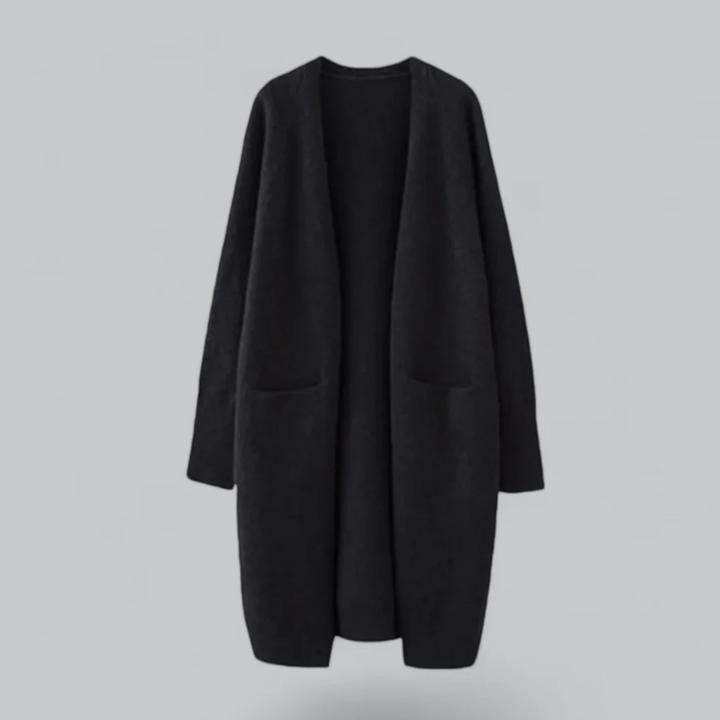 Cardigan long femme élégant avec poches, parfait pour une superposition chic et confortable en automne.