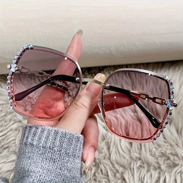Légères lunettes de soleil femme sans monture, branches fines, cristaux chic, confort maximal.
