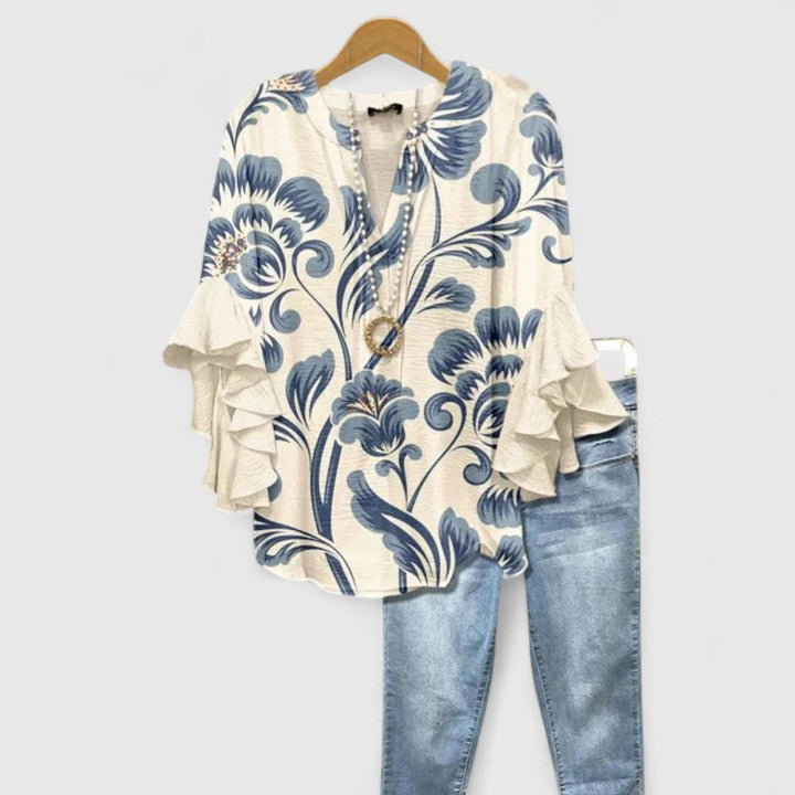 Blouse florale élégante pour femme, motif fleuri délicat, idéale printemps-été.