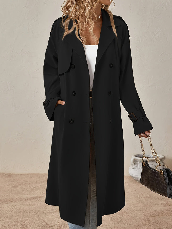 Trench-coat femme kaki, coupe longue et élégante, avec boutons distinctifs.