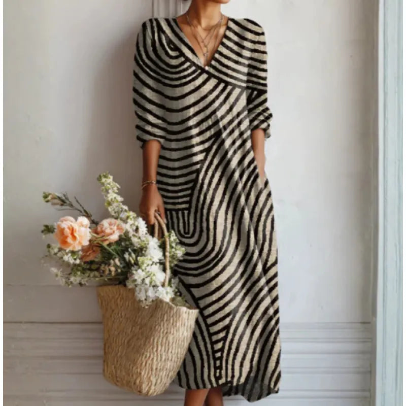 Robe midi femme, style décontracté élégant. Manches longues fluides pour un confort printanier et estival chic.