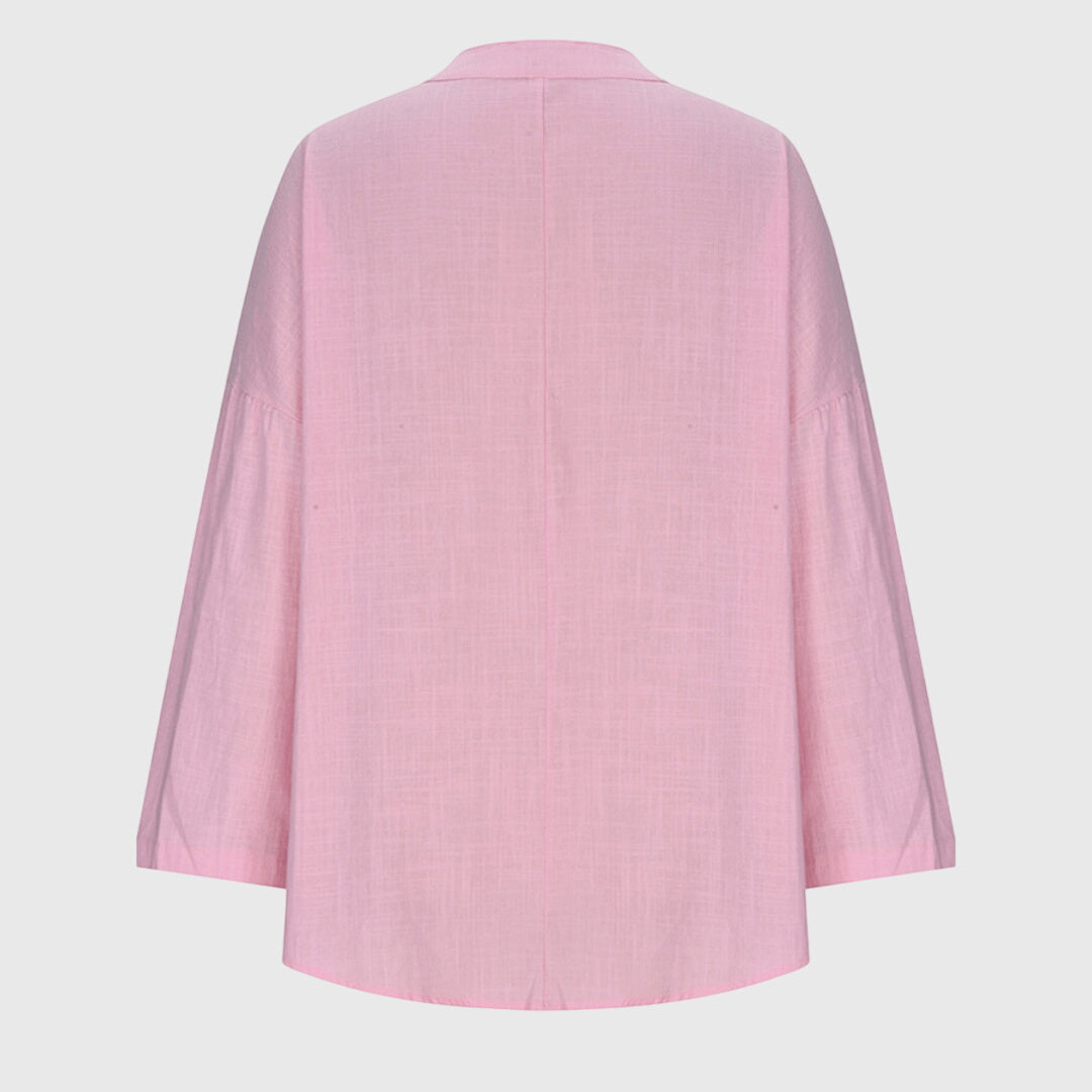 Chemise de plage femme à manches longues, fluide, élégante et décontractée, un essentiel pour l'été.