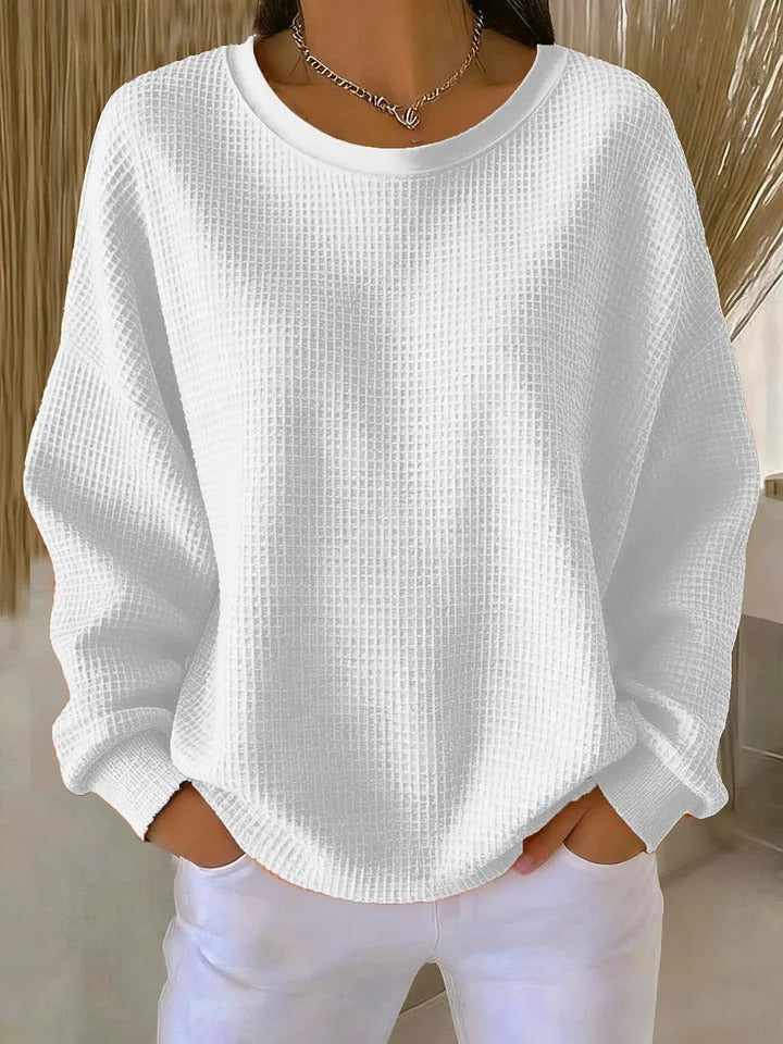Sweat-shirt femme texturé, alliant élégance casual et confort pour un look moderne et stylé.