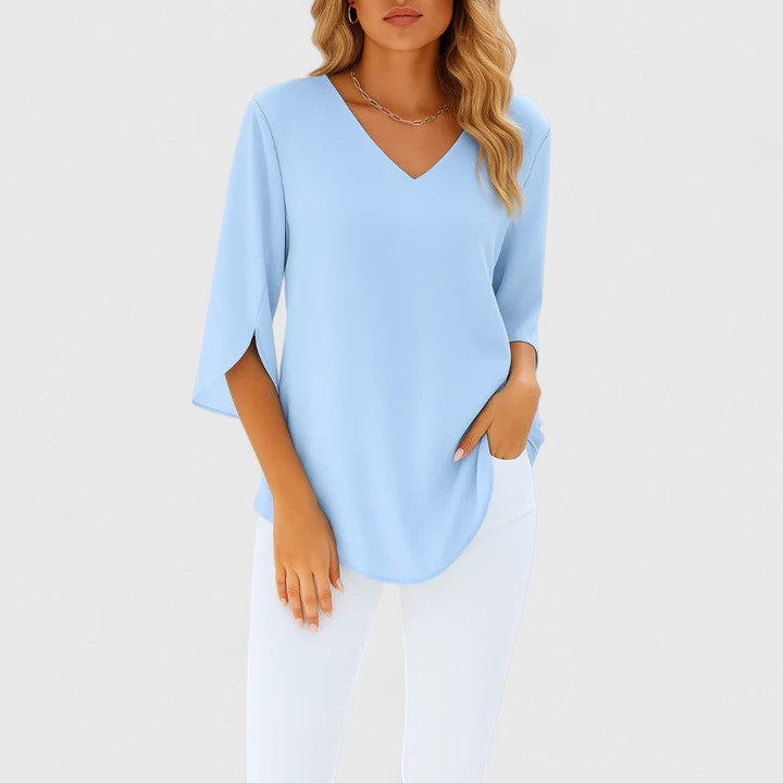 Blouse féminine et raffinée, vêtement fluide à manches fendues, élégante pour le bureau ou sortie estivale.