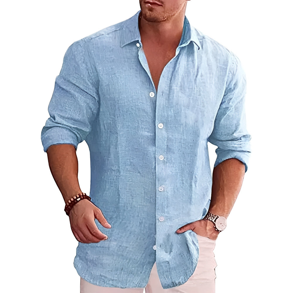 Chemise homme slim fit bleue, style polyvalent, idéale pour un look décontracté chic ou professionnel. Tissu doux.