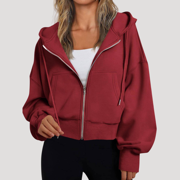 Veste à capuche décontractée pour femme, design moderne avec manches ballon. Confort et style assurés.