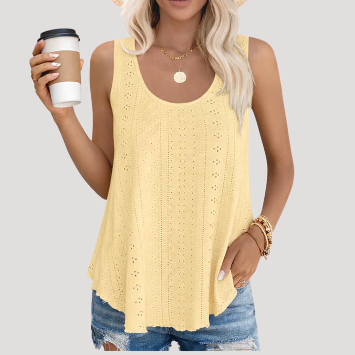 Top estival chic et versatile pour femme, avec broderie anglaise. Confortable et élégant pour toutes les occasions.