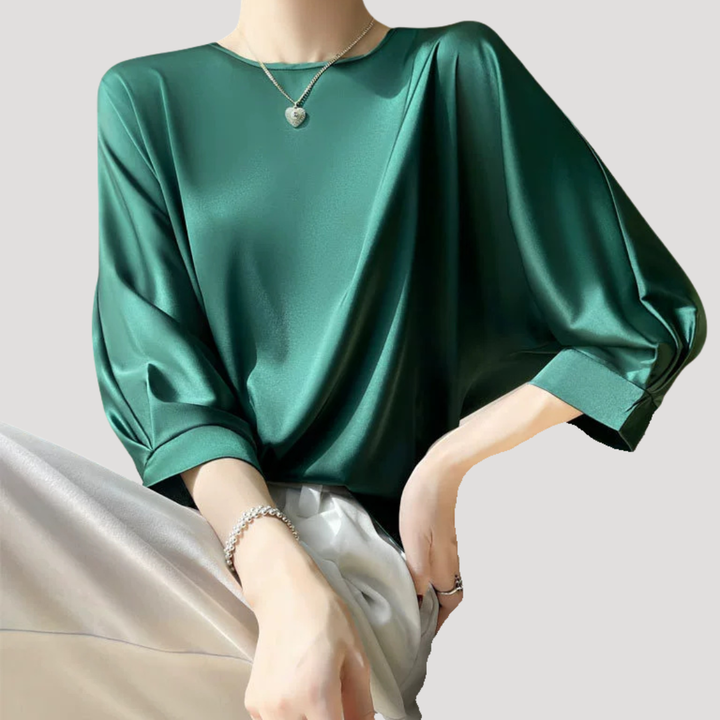 Blouse femme chic printemps-été, col rond, manches 3/4. Idéale pour un style élégant et aéré.