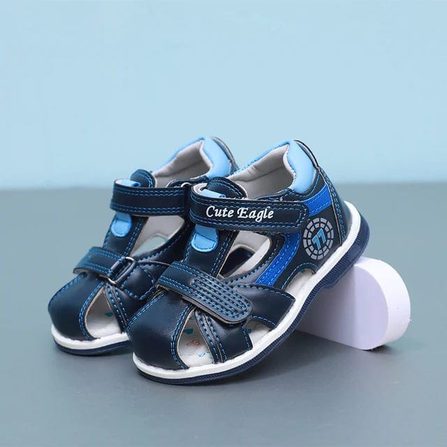 Sandales orthopédiques bébé garçon bleu et orange pour l'été, offrant confort et maintien aux premiers pas.