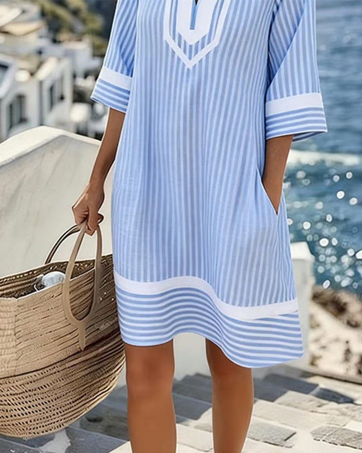 Robe femme décontractée à rayures, coupe droite. Idéale pour un look estival élégant et confortable.