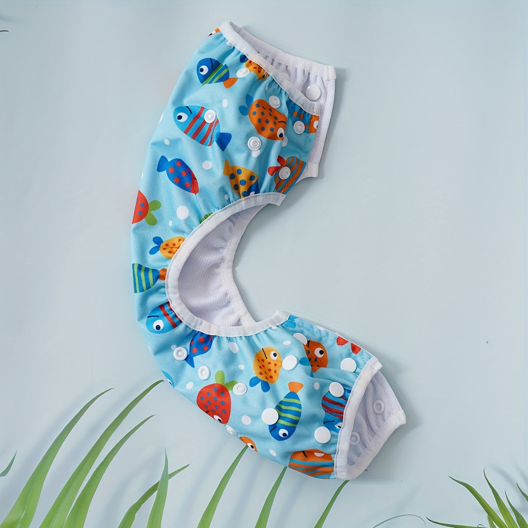 Culotte de bain bébé réglable, lavable, avec motifs marins colorés. Pour des moments joyeux à l'eau.