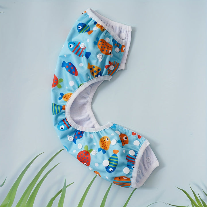 Culotte de bain bébé réglable, lavable, avec motifs marins colorés. Pour des moments joyeux à l'eau.