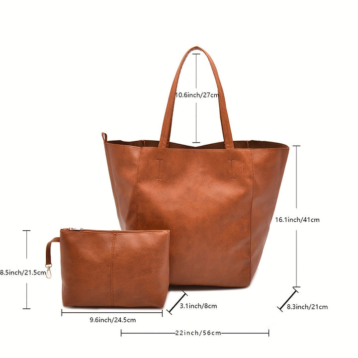 Détail des anses confortables du sac tote élégant en simili cuir doux, grand sac pratique pour femme.