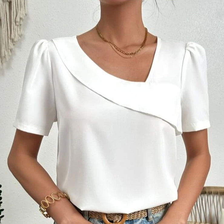 Blouse femme Josianne d'été, col asymétrique, manches bouffantes. Mode chic et tendance printemps-été.